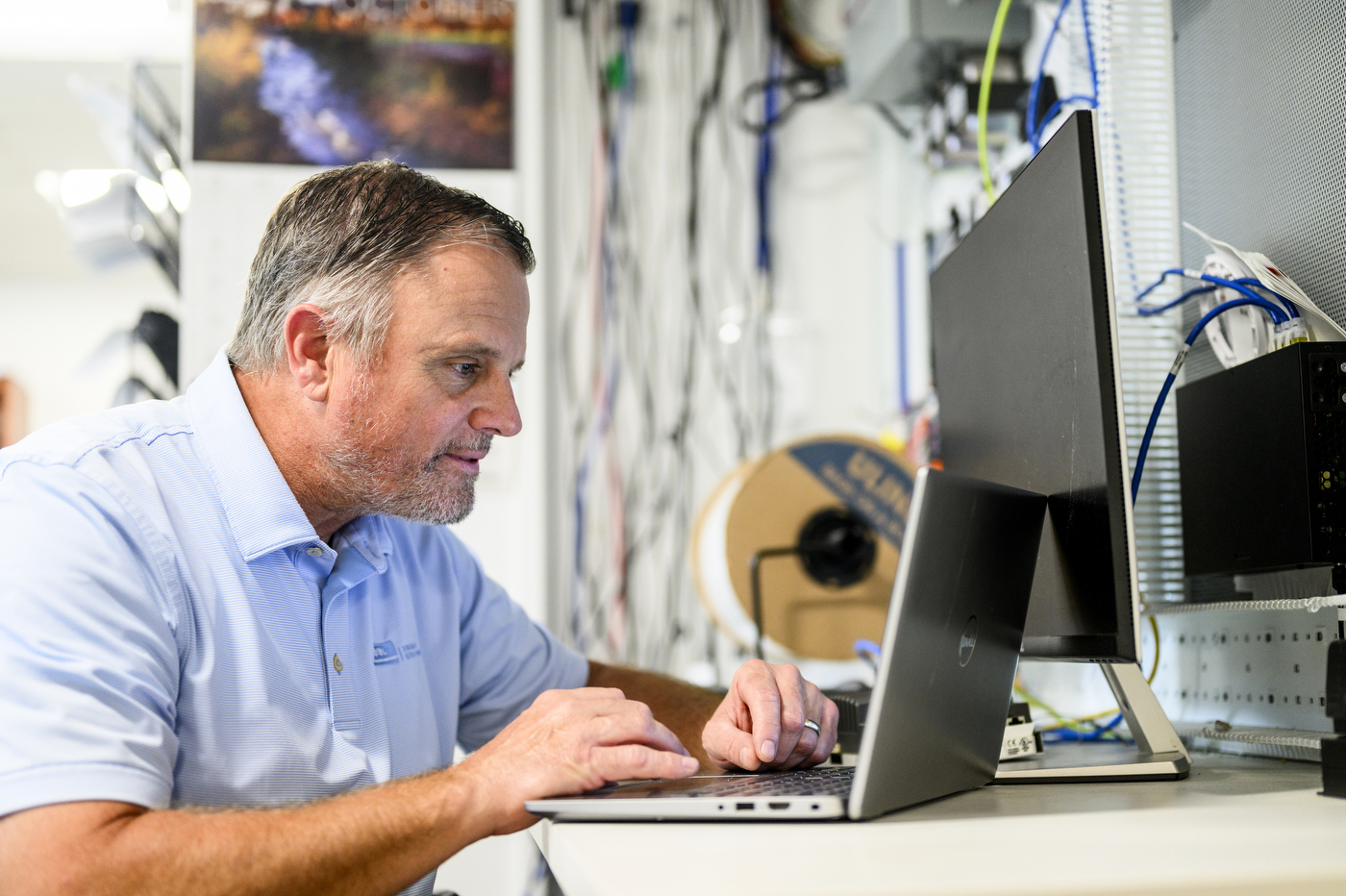 Joe Ranahan works on a laptop.