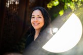 Ana Solorzano, a computer science student, smiles against a leafy backdrop.