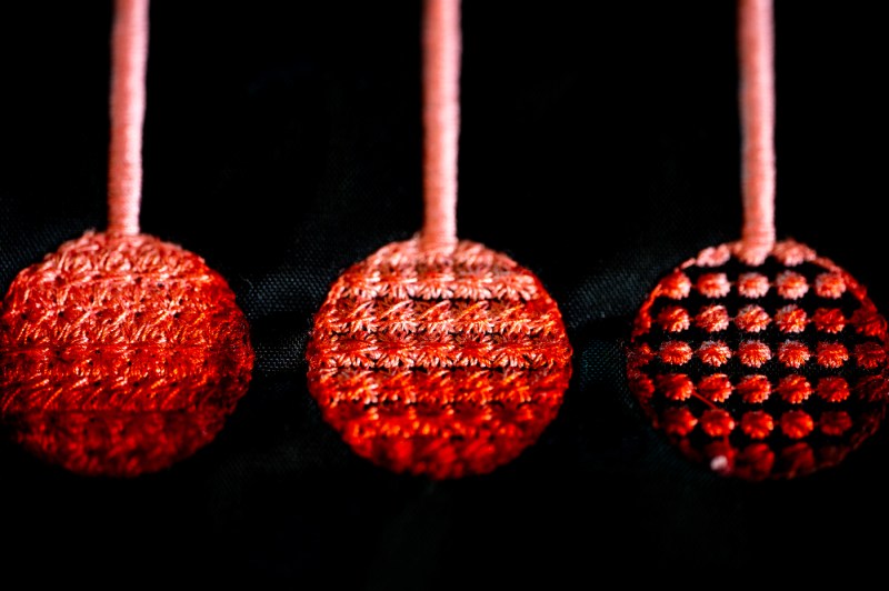 A close-up of embroidery being used for research purposes.
