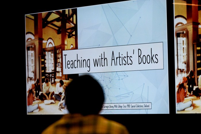 A "Teaching with Artists' Books" sign displayed during a Northeastern Snell Library special collections event.
