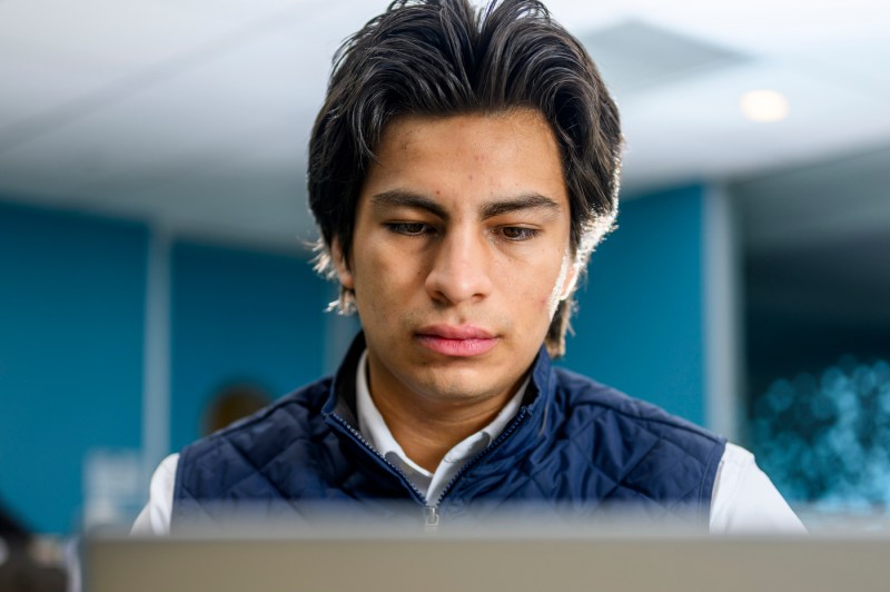 James Elespuru works on a laptop.