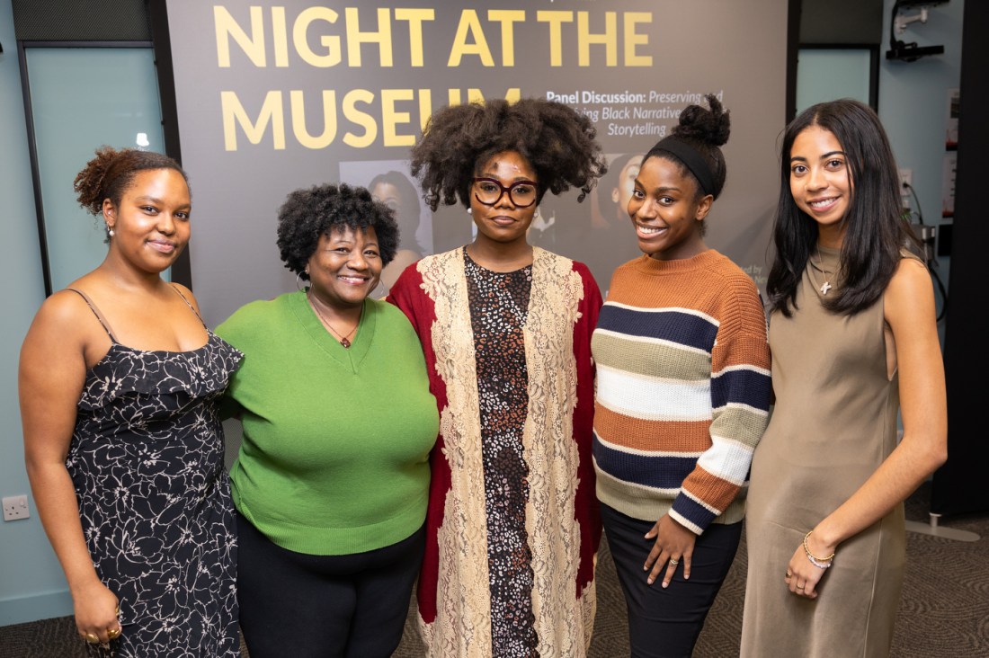 A group of six people smiling and posing together at Northeastern University London’s “Night at the Museum” event celebrating Black History Month.