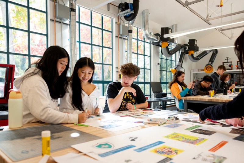 A group of students working at a table in The Makerspace.