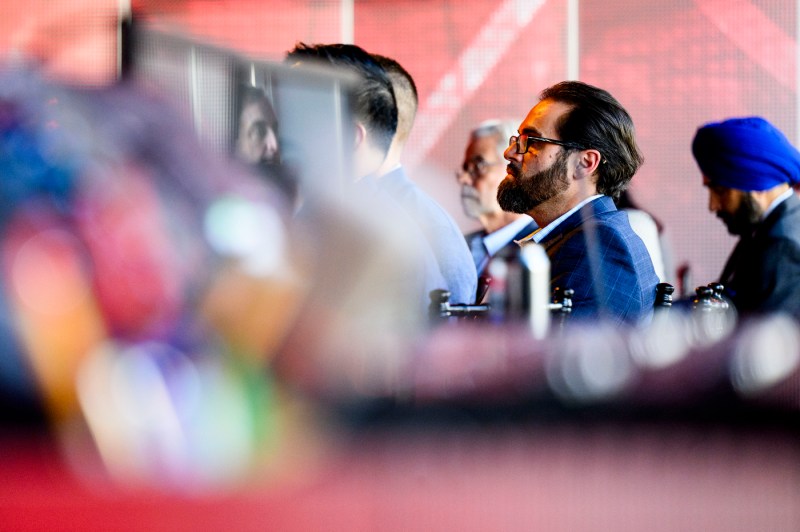 Audience members listening intently at the New England College of Optometry: Reimagining Optometry event. 