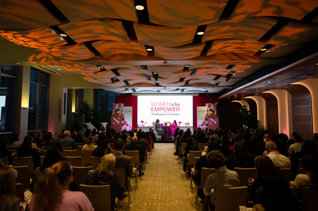 People sit in rows of chairs at the Women Who Empower summit.