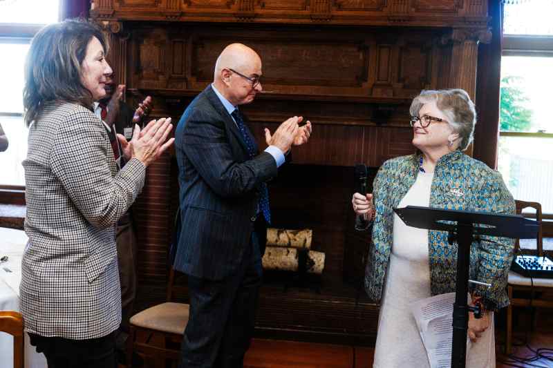 President Aoun and Diane Nishigaya MacGillivray clap for Deanna Jantzen.