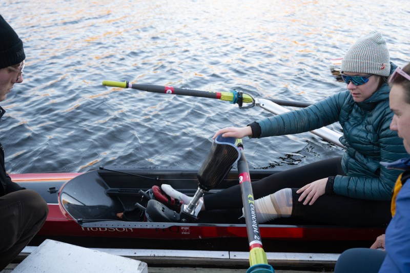  After rowing on the Charles River with her CRI coach Megan Hopkins removes the prosthetic foot and ankle, designed specifically for rowing by Northeastern students, from the boat on Tuesday, Nov. 18, 2025. 