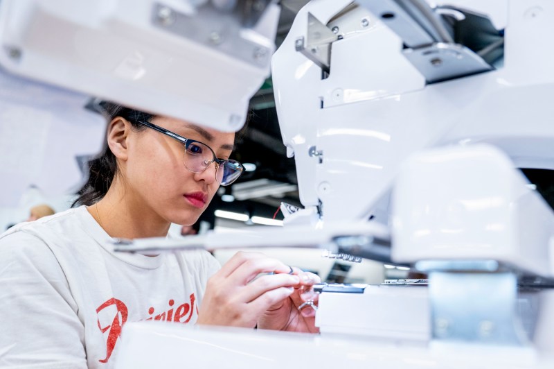 A student uses a sewing machine in the Makerspace.
