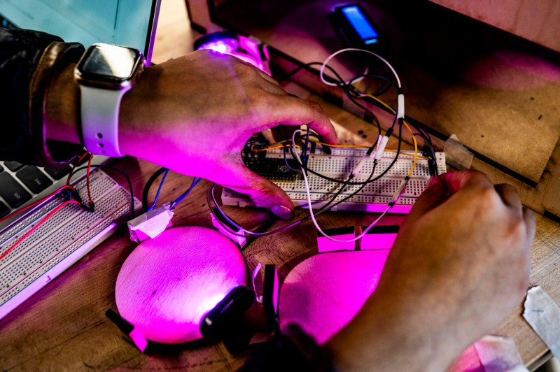 A closeup of a student who is doing electrical work.