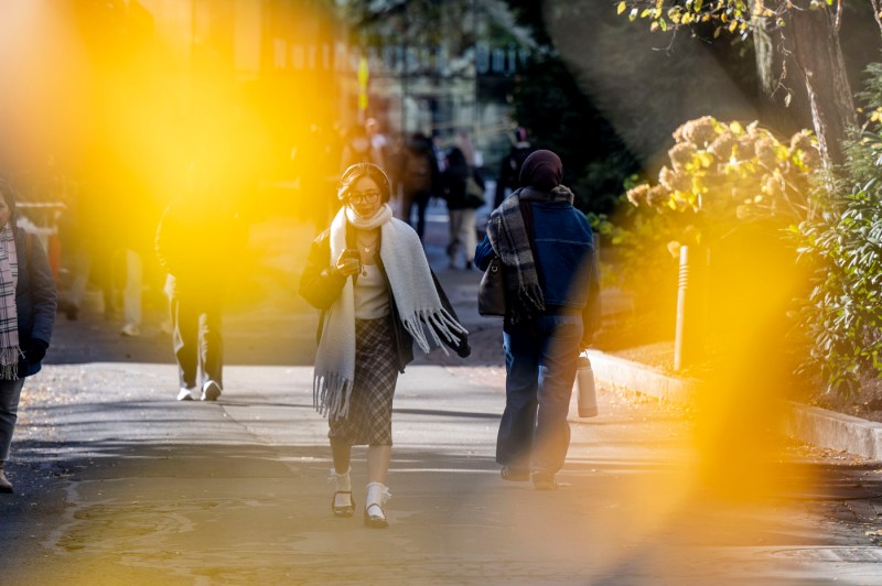 Students dressed for the cold weather walk through the Boston campus. 
