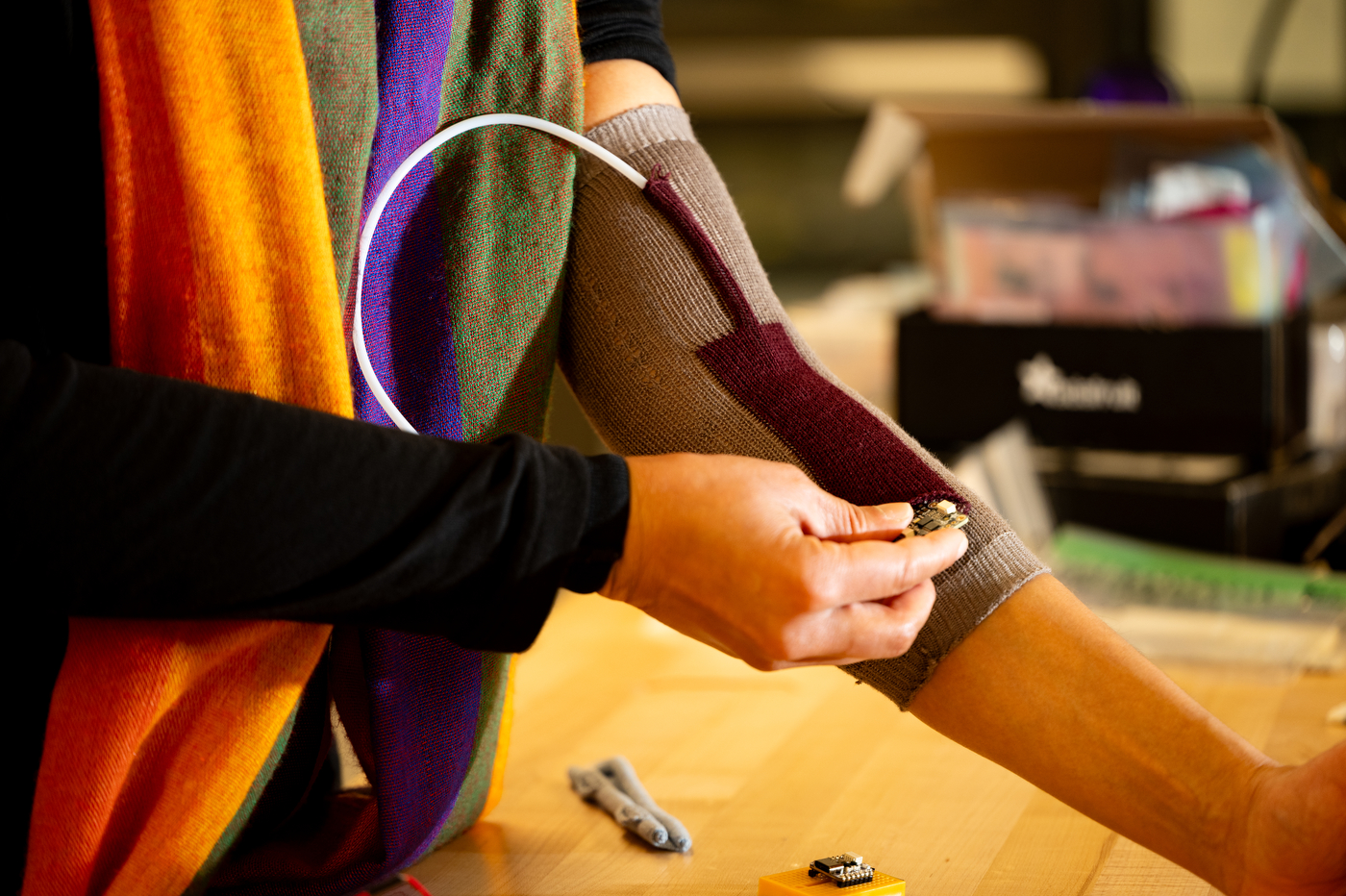 Kris Dorsey demonstrating how the adaptive splint on her arm works for people with severe autism. 