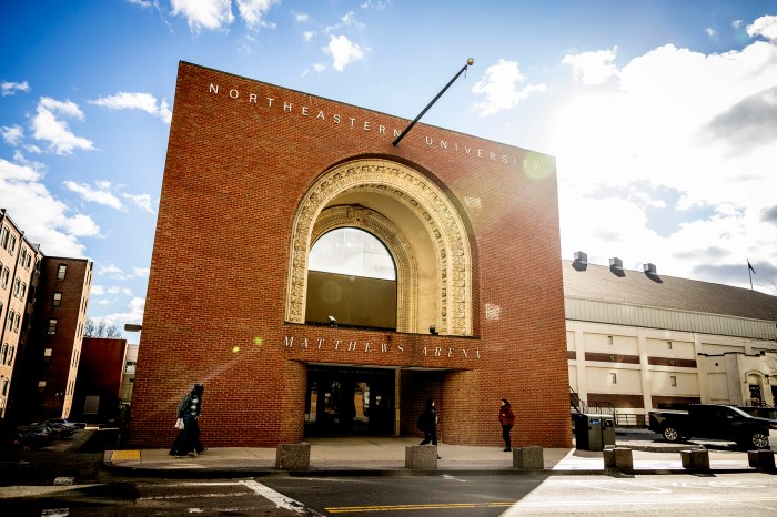 The Matthews Arena archway seen on a sunny day with blue skies in the background.