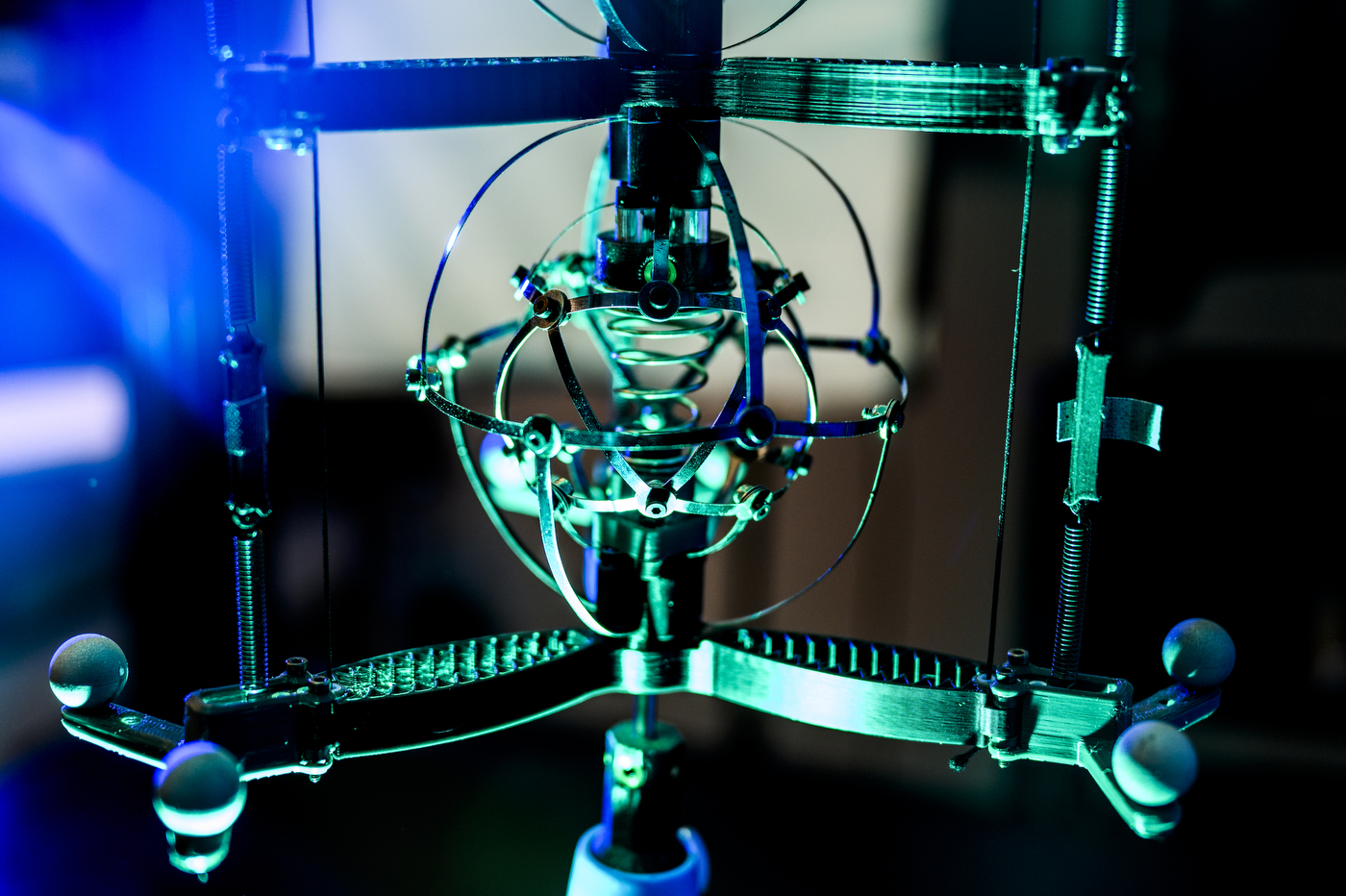Lab equipment illuminated by blue and green lighting.
