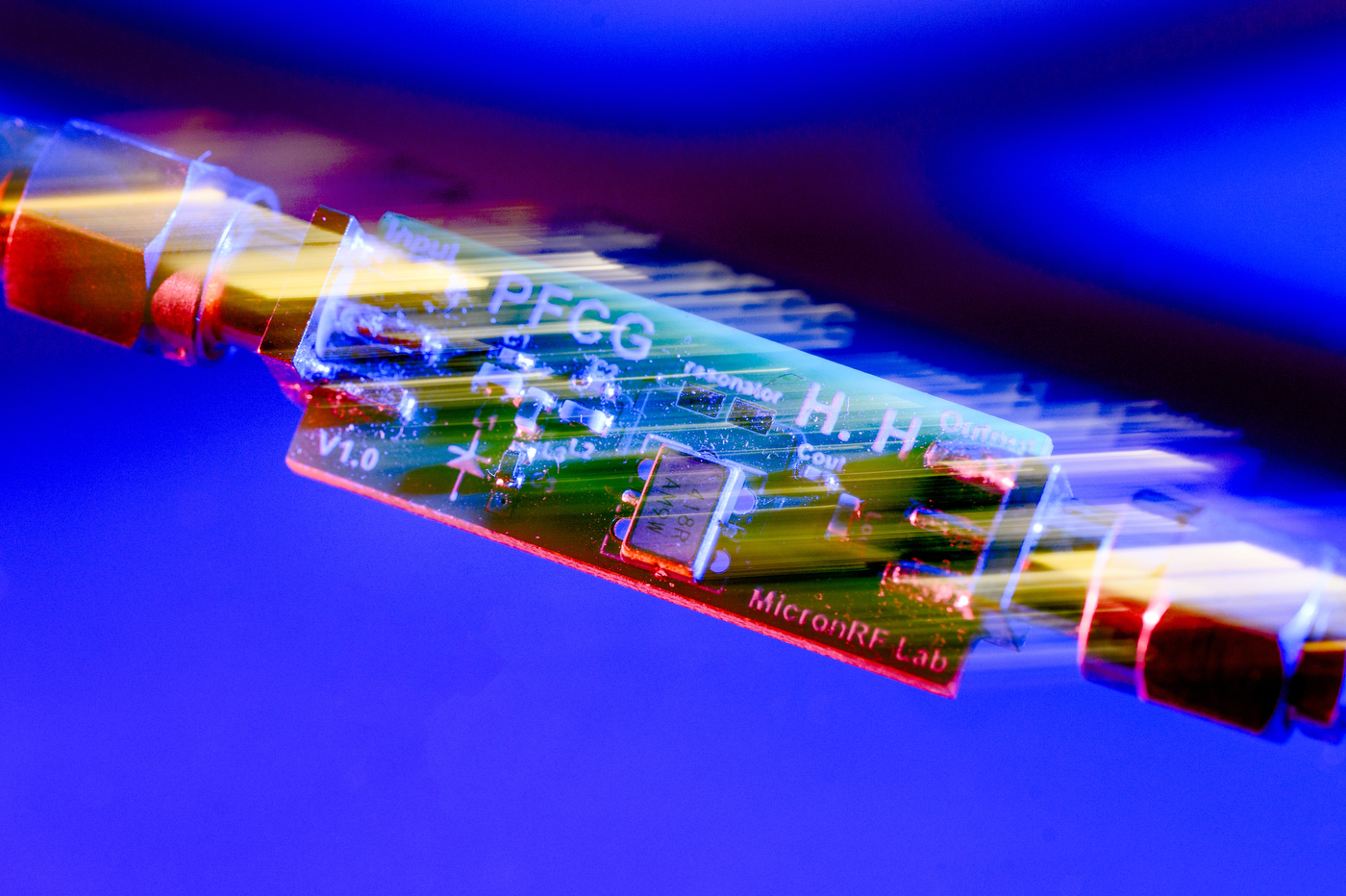 A colorful microchip illuminated against a blue background. 