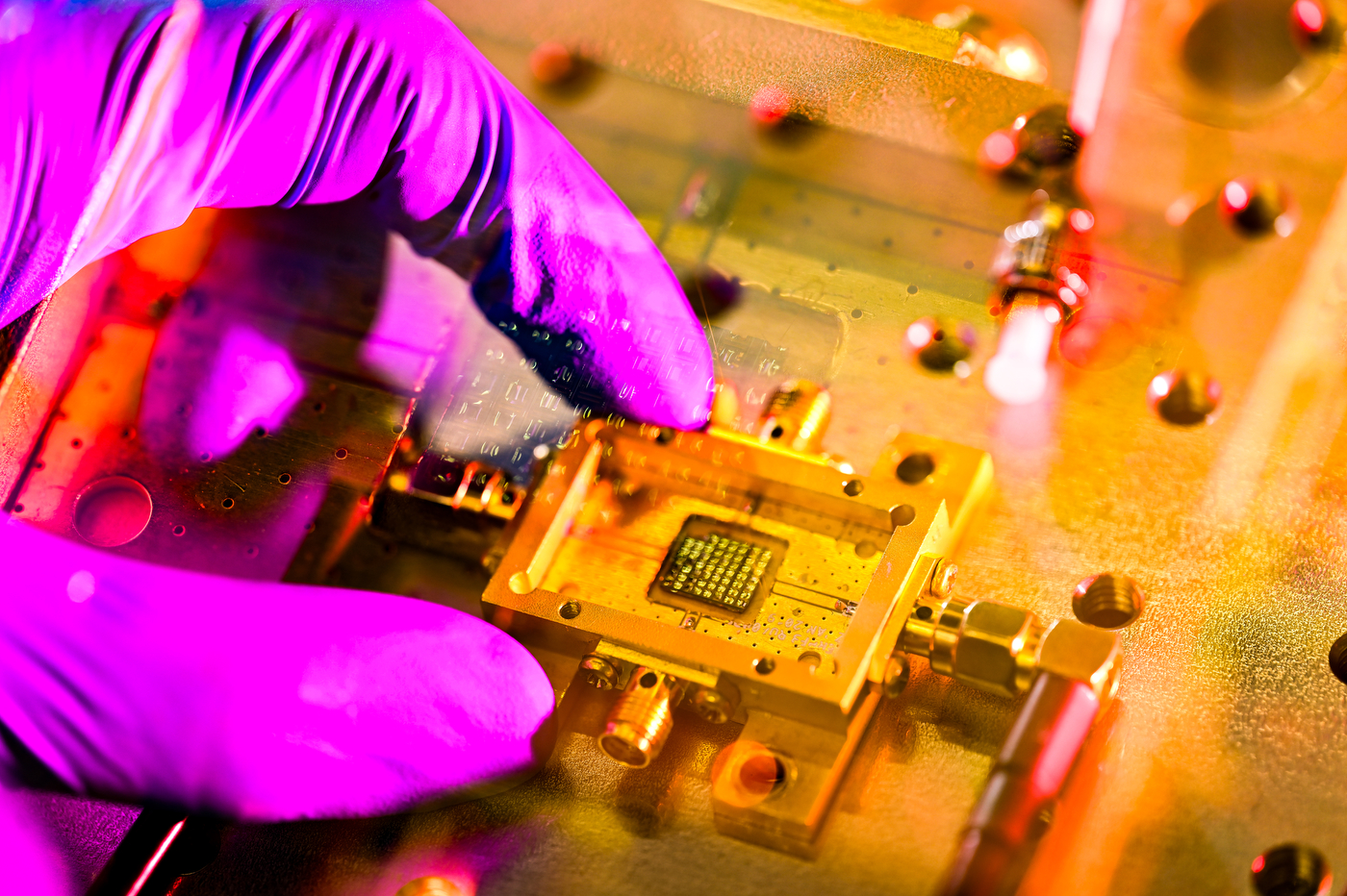 Closeup of gloved hand hold the sensor.