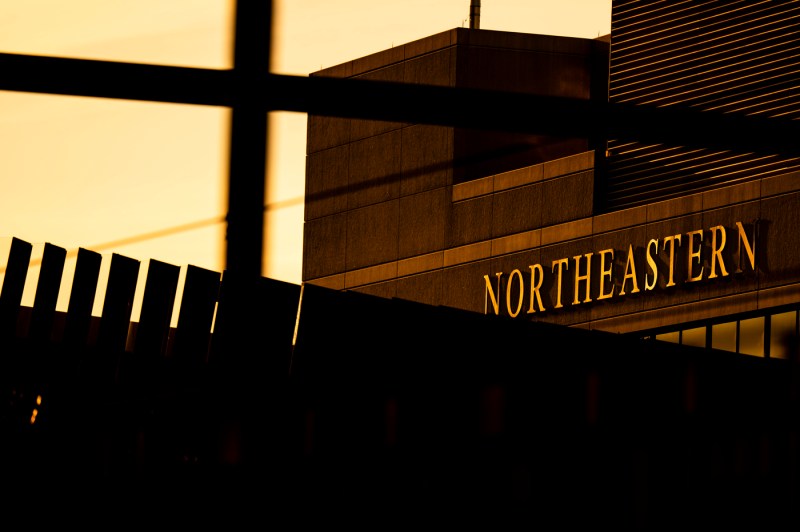 A close up of a Northeastern campus building reflecting afternoon sun.