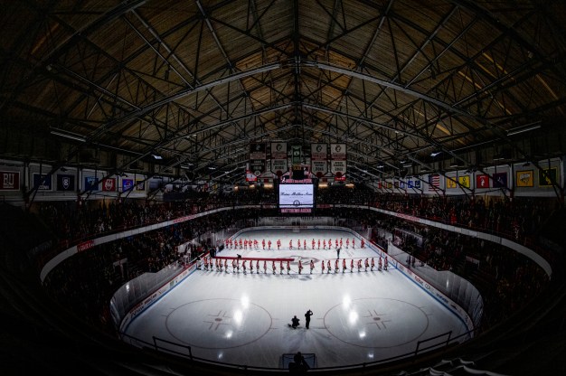An overview of Matthews Arena, as players from both Northeastern University and Boston University line up before the game.
