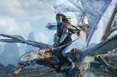 A blue-skinned character from the film series "Avatar" flies on a winged creature.