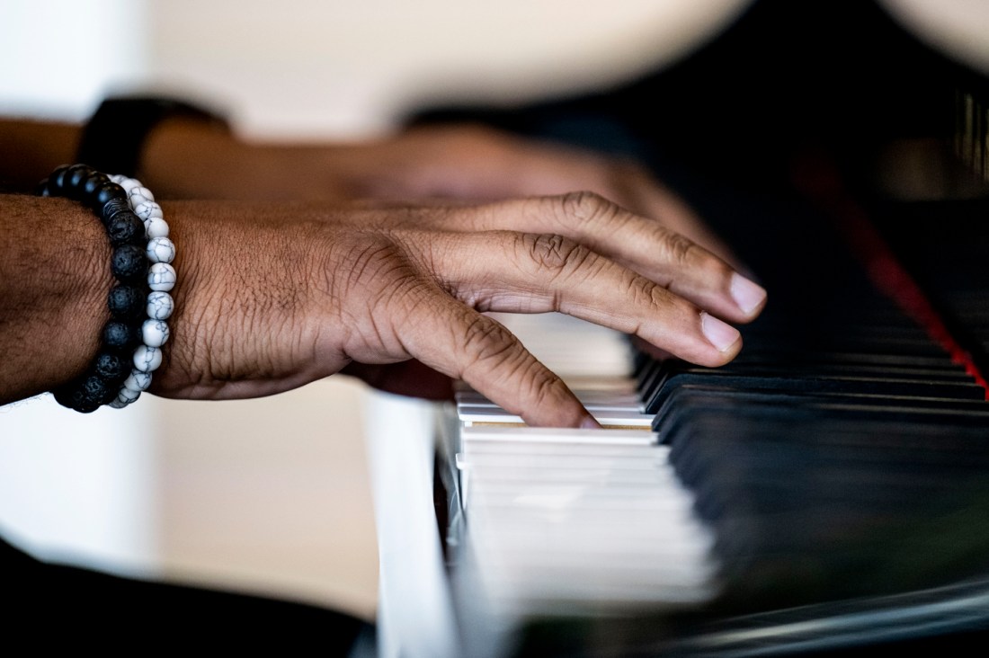 The hands of a pianist while they are playing. 