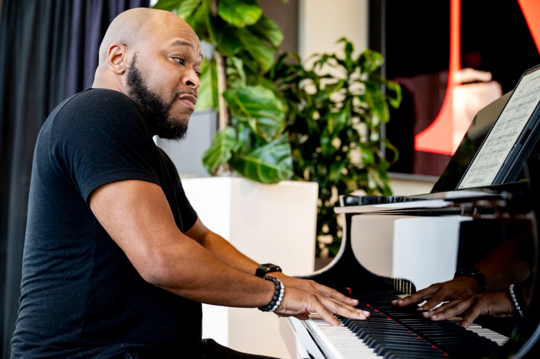 A pianist playing during a musical performance at the MLK ceremony. 