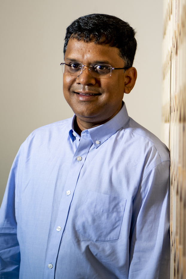 Portrait of Auroop Ganguly wearing a blue button down. 