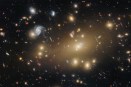 Galaxy cluster with golden elliptical galaxies surrounded by distant spiral galaxies and gravitational lensing arcs against deep space.
