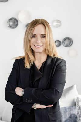 Jody Kipnis, co-founder, CEO and president of the foundation, smiles while standing in a black suit.