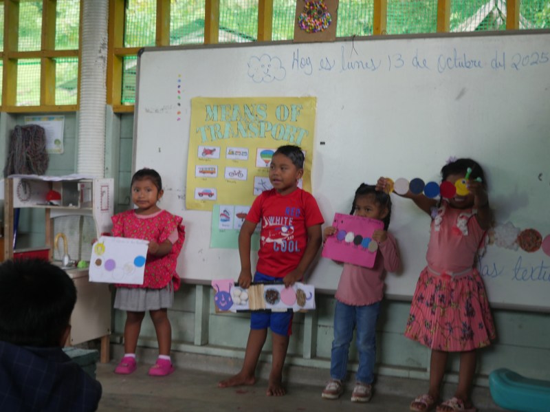 Students show off their artwork from a preschool program through Give and Surf in Bocas Del Toro, Panama