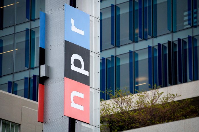 The exterior of a the NPR headquarters with their 'NPR' logo on it, with the 'n' in a red square, the 'p' in a black square, and the 'r' in a blue square.