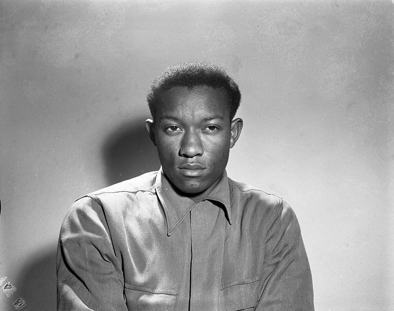 Black and white portrait of Tommy Lee Walker.