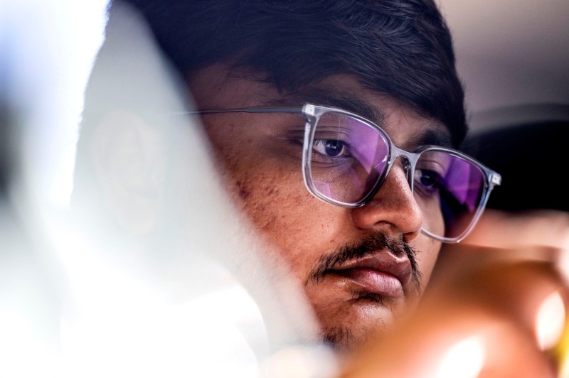 A close up of a students' face inside Snell Library.