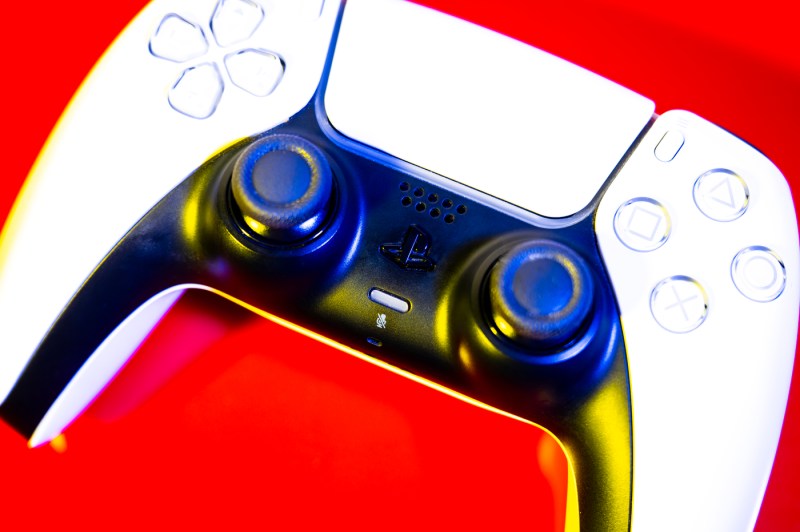 A close up of a white game console controller.