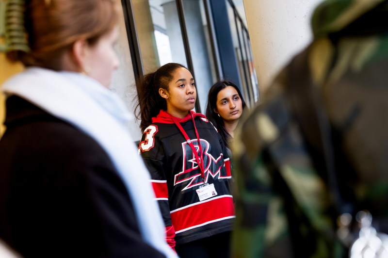 People watch a speaker