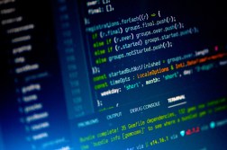 Lines of code displayed on a laptop screen.