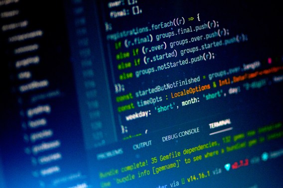 Lines of code displayed on a laptop screen.