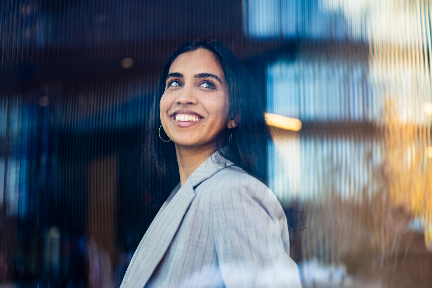 A portrait of Arshia Mathur, who is smiling and looking to the right.
