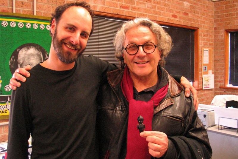 A young Michael Ulman stands shoulder to shoulder with Mad Max: Fury Road director George Miller during the making of Fury Road.