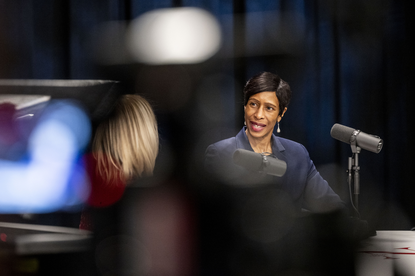 Ann Simmons speaks into a microphone during the taping of an NGN Podcast episode at Northeastern University.
