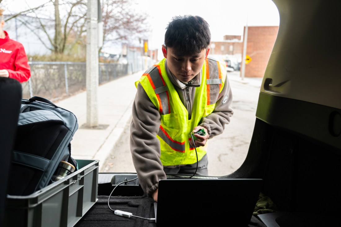 Northeastern students review and heat and noise sensors installed in Roxbury. 