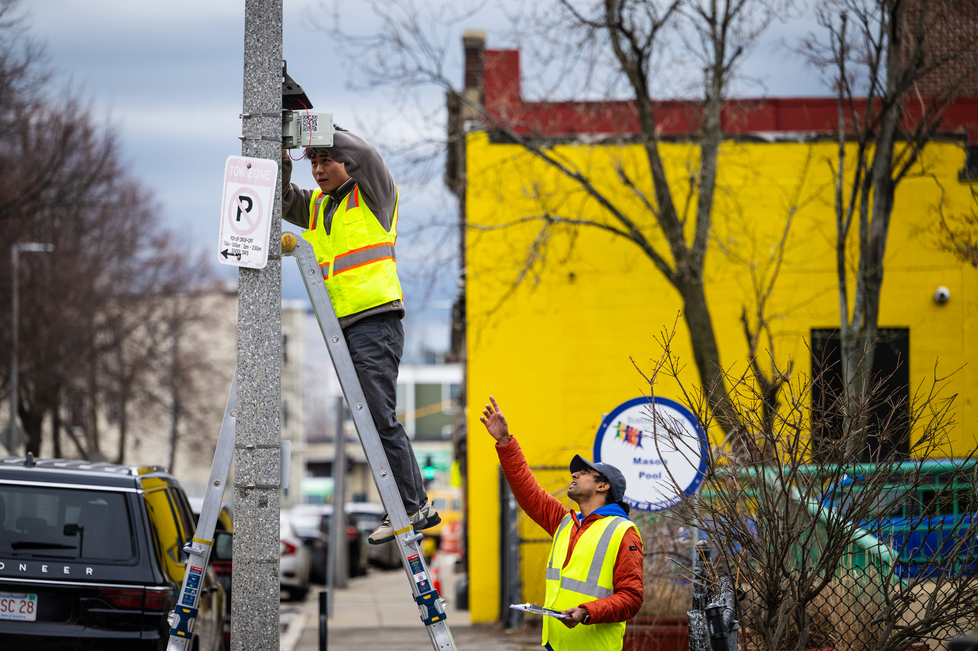 Northeastern students review  heat and noise sensors installed in Roxbury. 