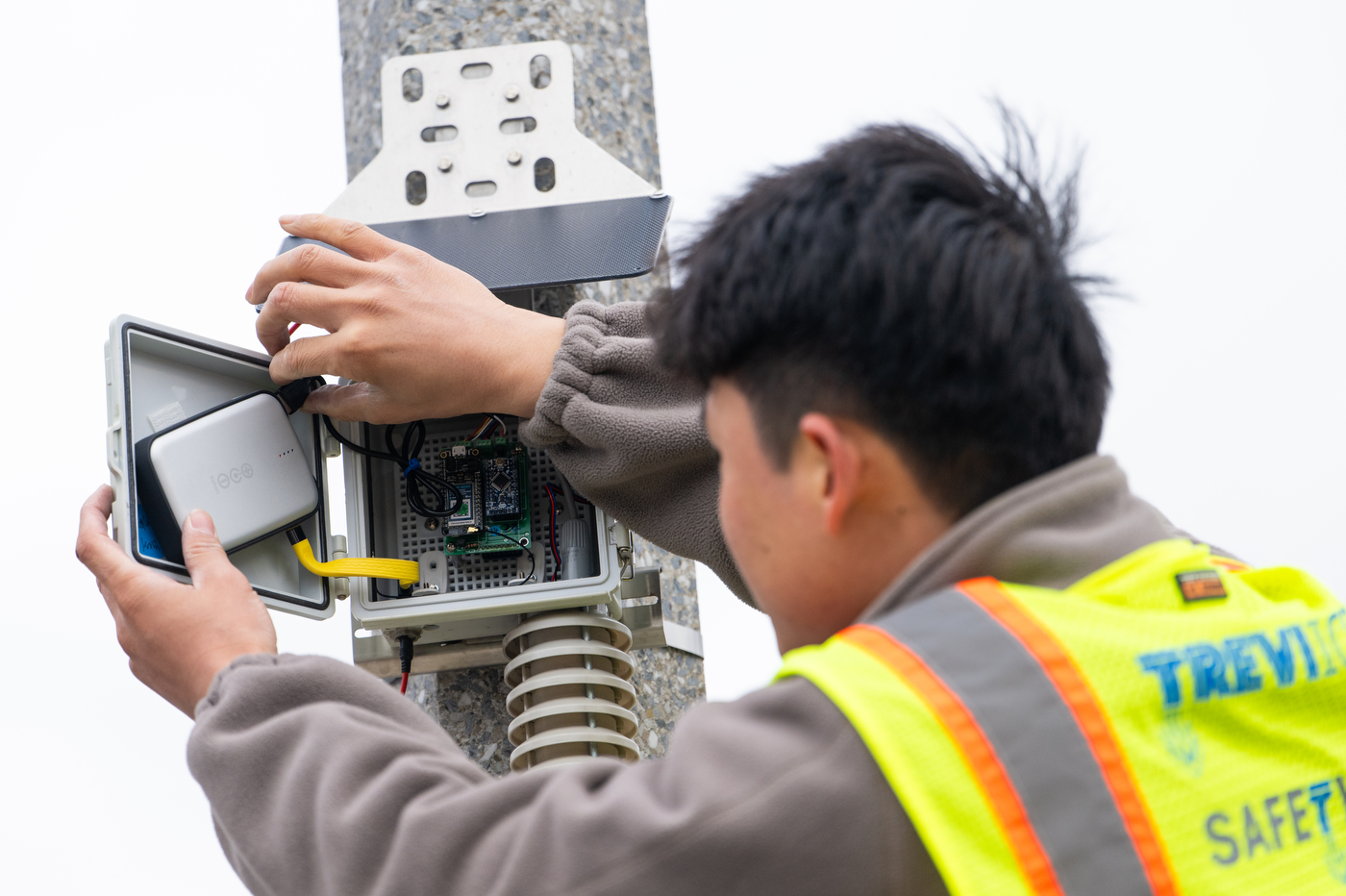 Northeastern students review  heat and noise sensors installed in Roxbury. 