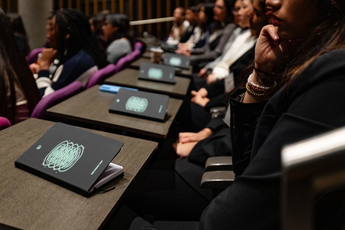 Audience members sit in tiered seating, listening attentively during a session at the 2026 WISE Summit.