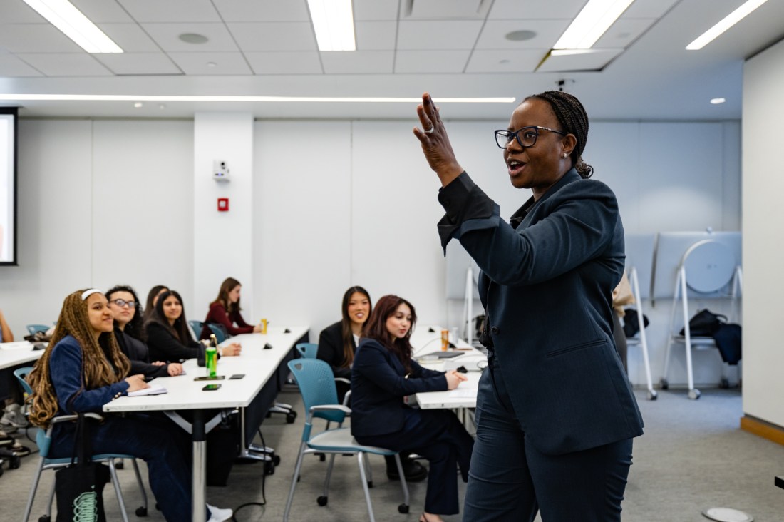 A speaker gestures while addressing a classroom of seated participants during a session at the 2026 WISE Summit.