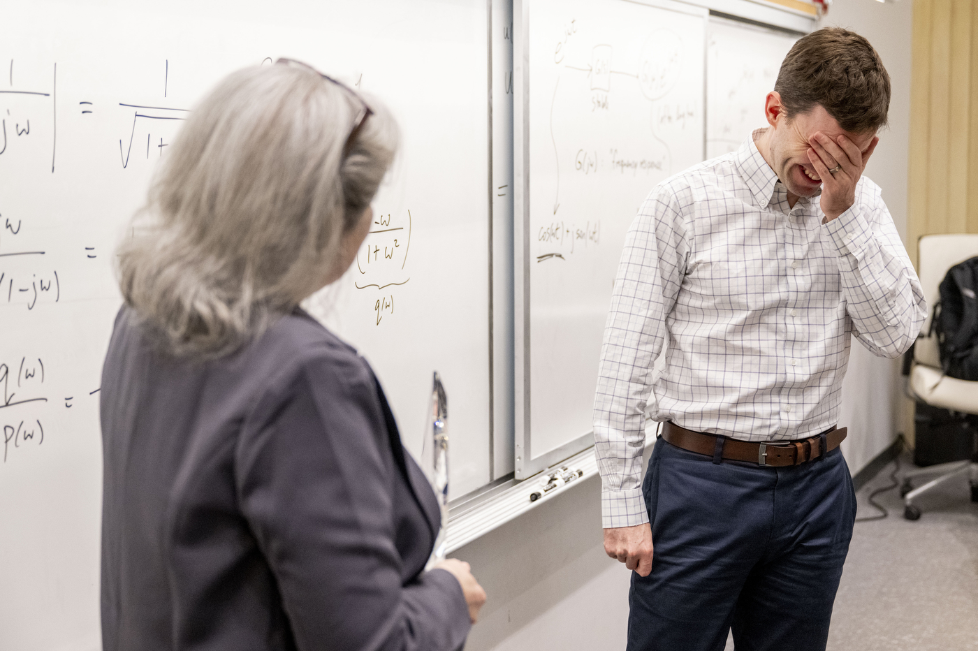 Provost Beth Winkelstein surprises professor Laurent Lessard with the University Excellence in Teaching Award during Lessard’s class in the Snell Engineering building on March 31, 2026. Photo by Matthew Modoono/Northeastern University