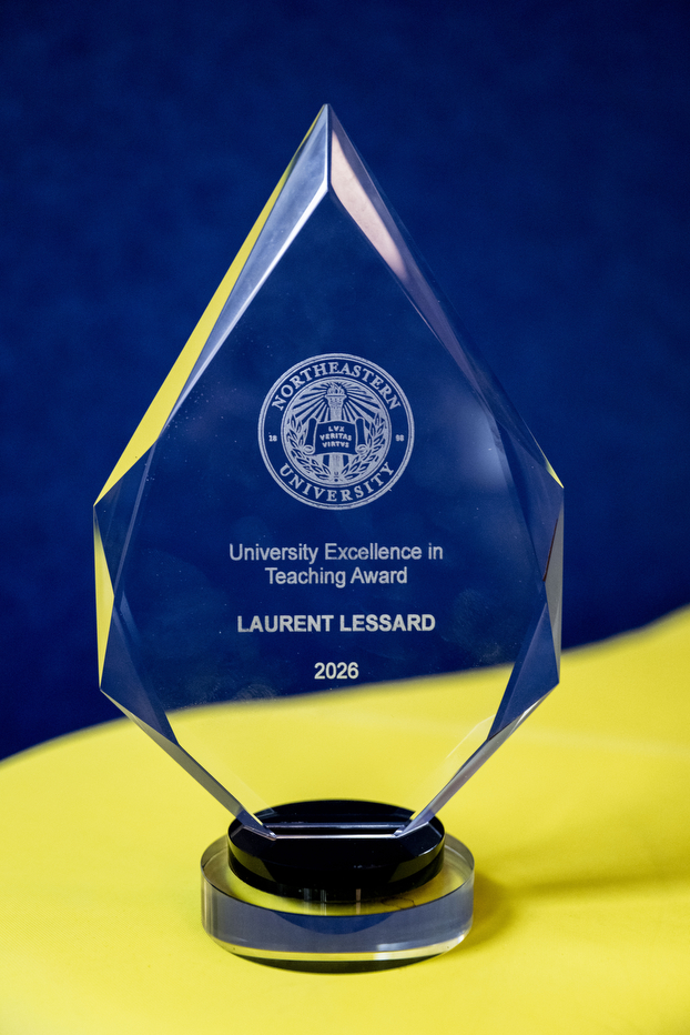 The Northeastern University Excellence in Teaching Award placed on a yellow table. 