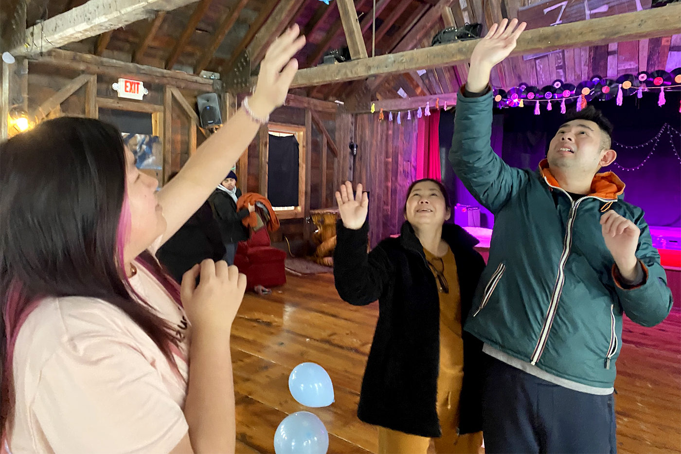 Campers at AAC Family Camp play balloon joy, a game where they toss balloons in the air
