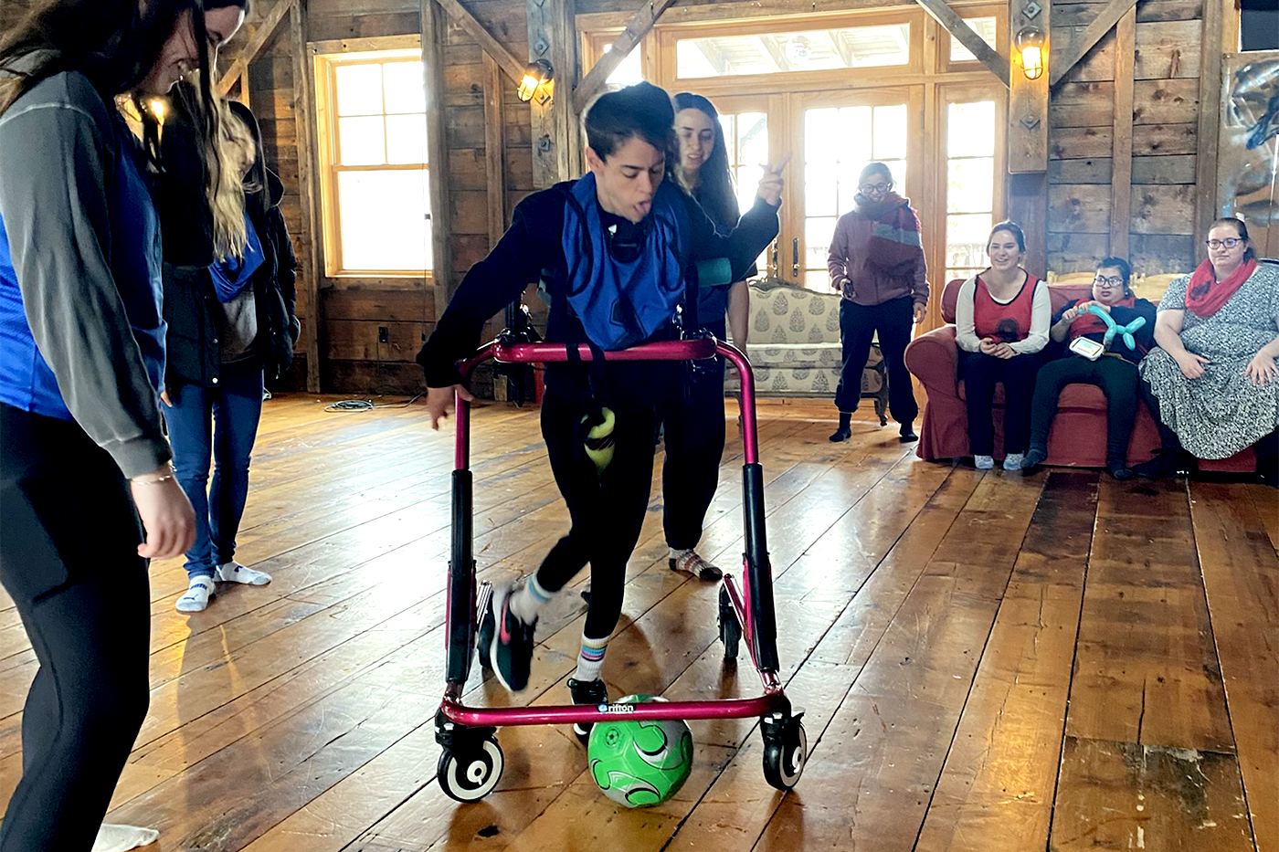 A participant at AAC Family Camp plays soccer