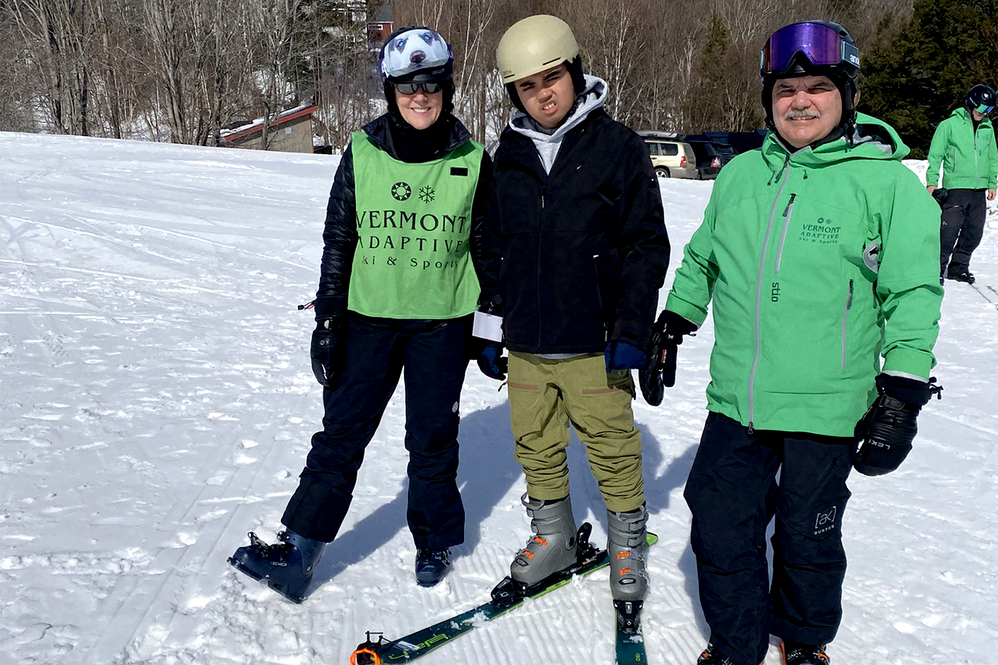 Participants at AAC Family Camp pose while skiing
