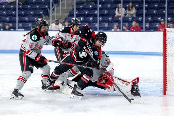 The Huskies clash with the Ohio State Buckeyes on the ice at the Frozen Four.