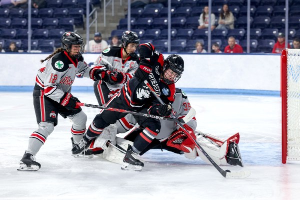 The Huskies clash with the Ohio State Buckeyes on the ice at the Frozen Four.